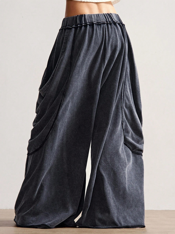 Dark gray wide-leg pants on a neutral background
