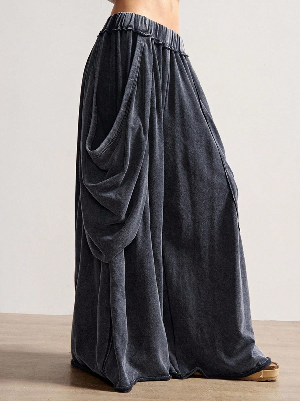 Dark gray wide-leg pants on a neutral background