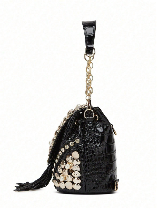Black textured handbag with pearl embellishments on a white background