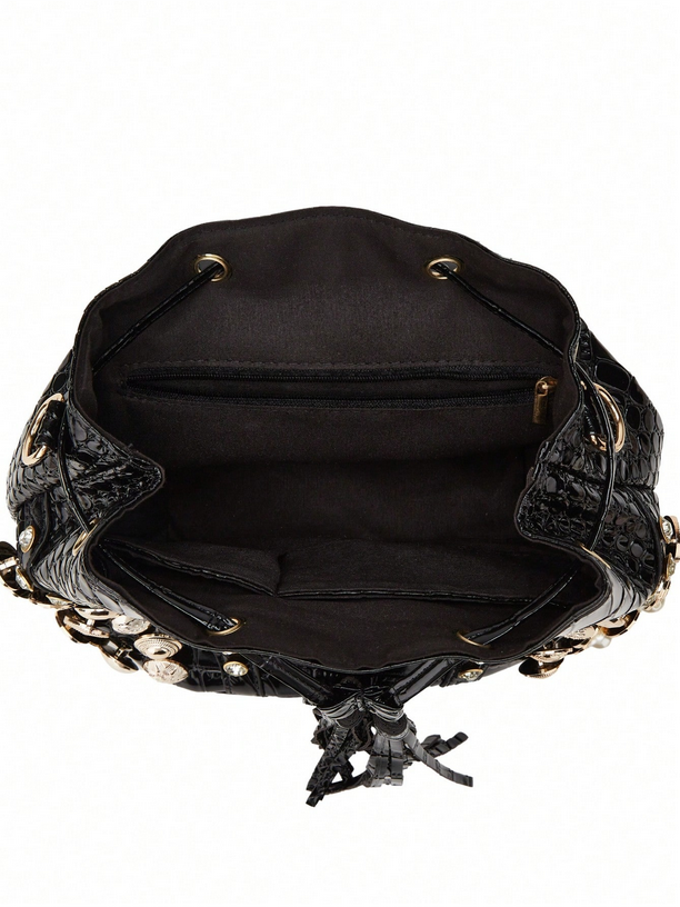 Black leather handbag with decorative studs on a white background