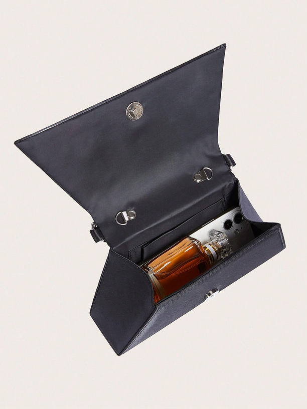 Open dark blue leather case with a bottle inside on a light gray background