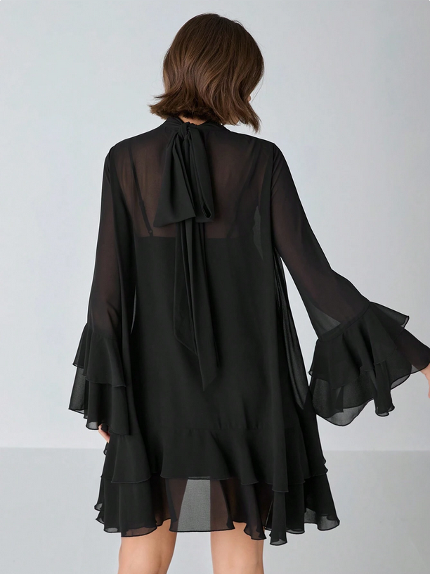 Black dress with sheer sleeves and back on a white background