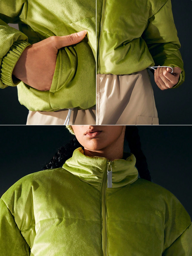 Green jacket worn by a person with close-up details on a dark background