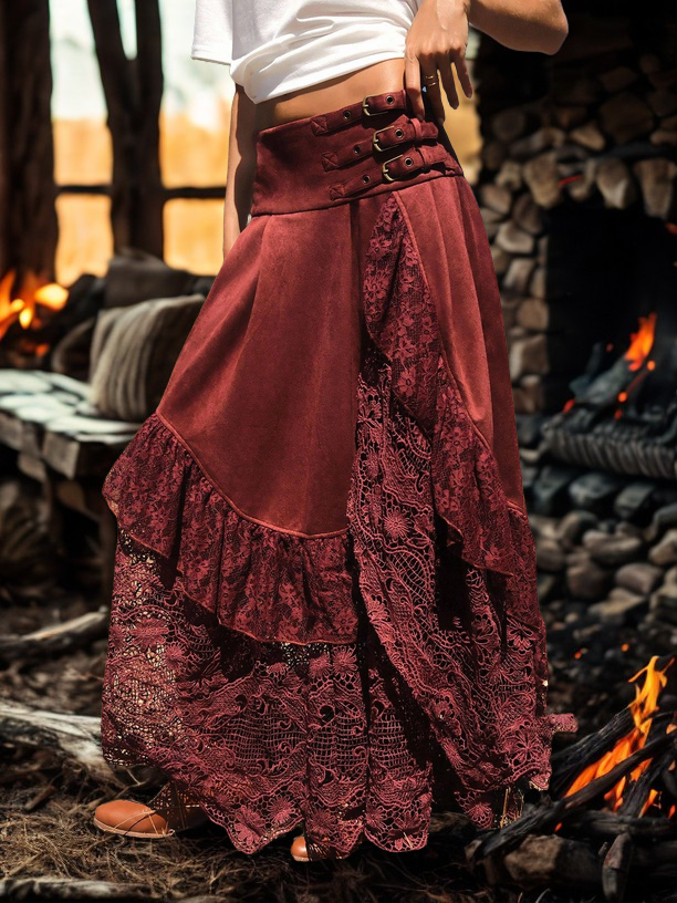 Person wearing a burgundy lace skirt in front of a fireplace